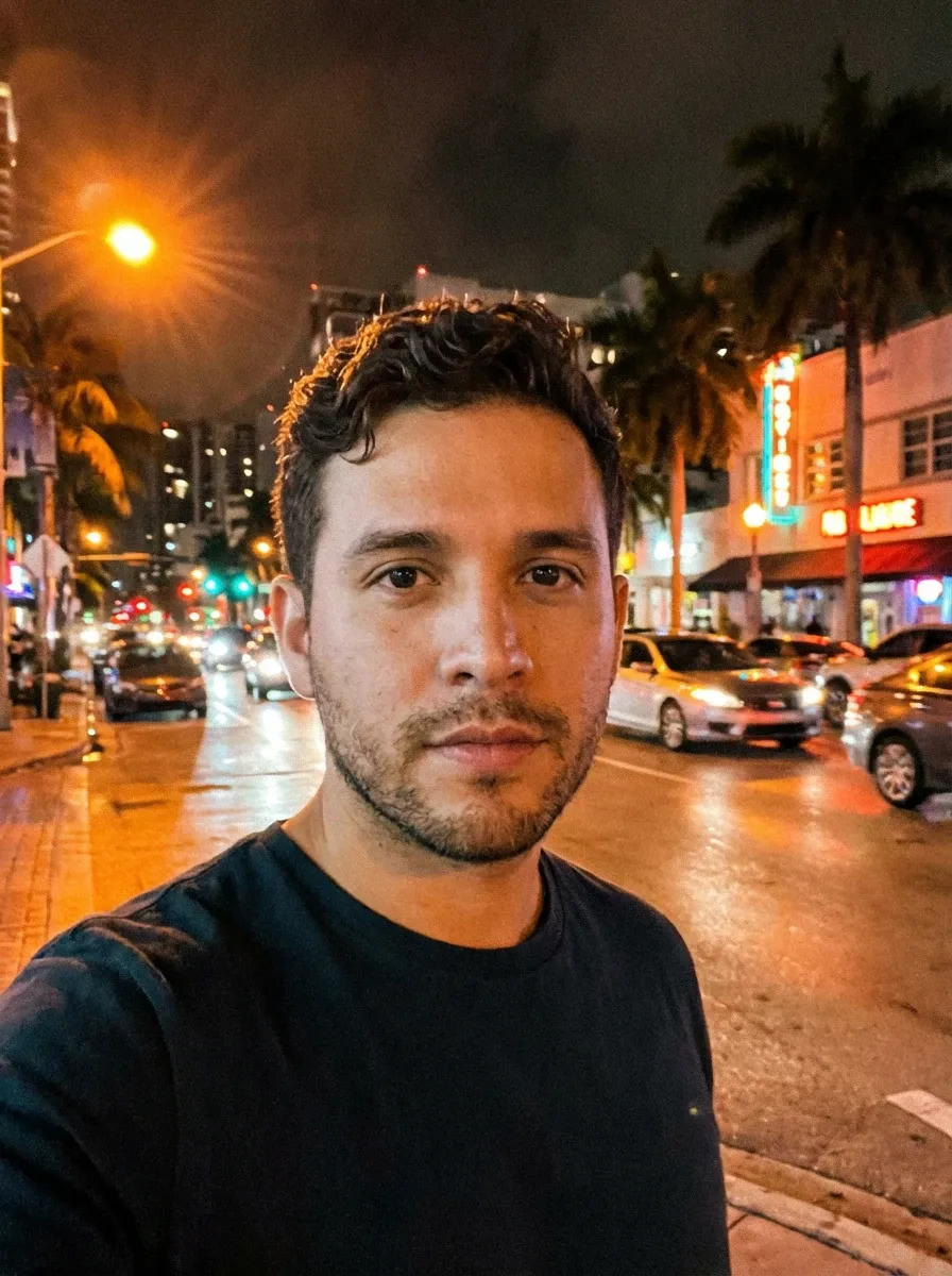 Original selfie input — man in a black T-shirt on a night street